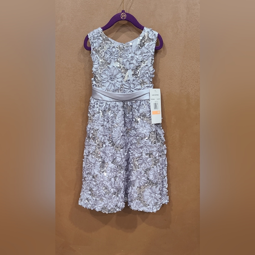 Girl "Rare Editions " silver sequence dress. Attached petticoat